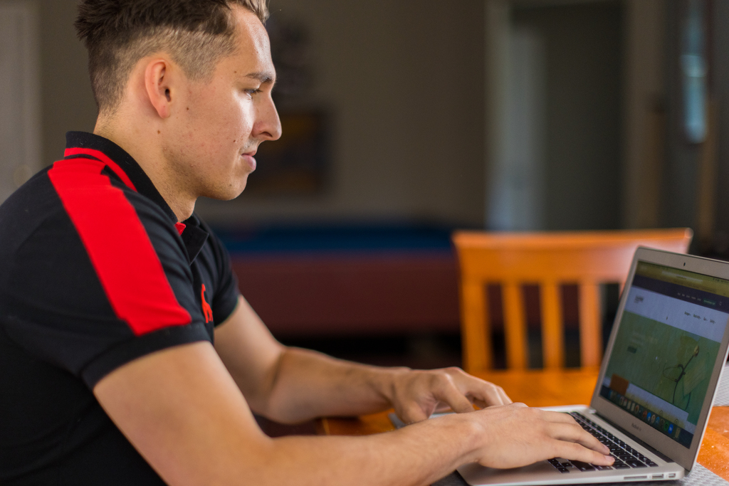A man browsing the internet on a laptop