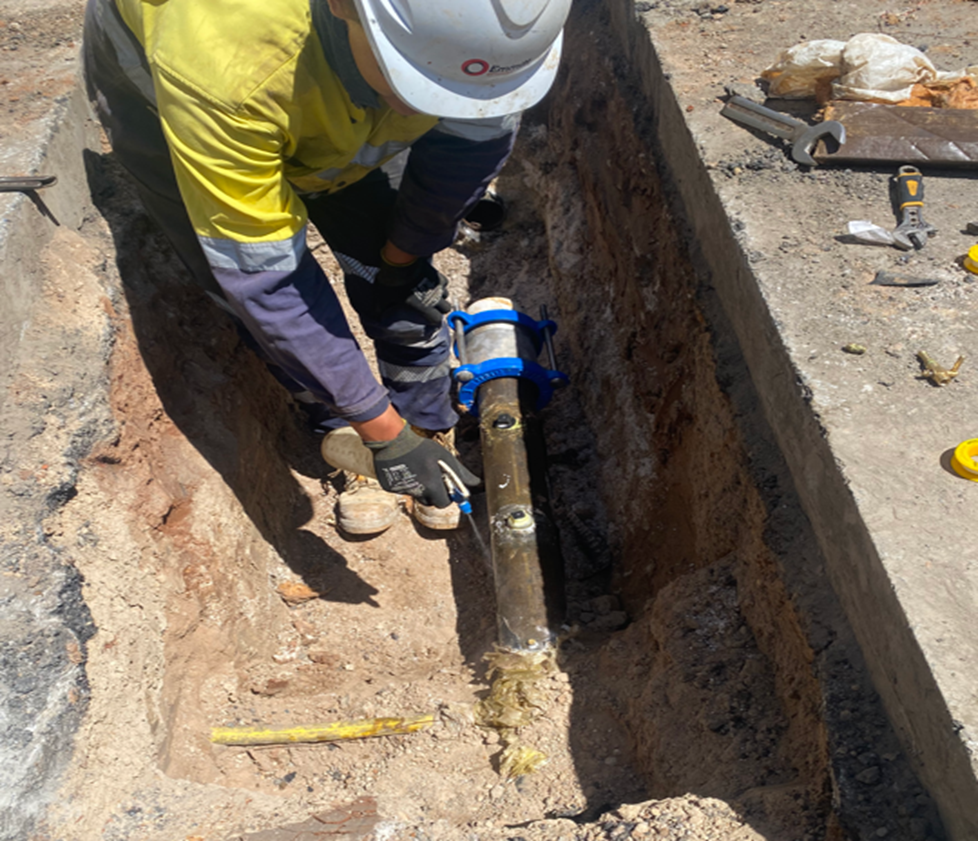 A person working on a gas line